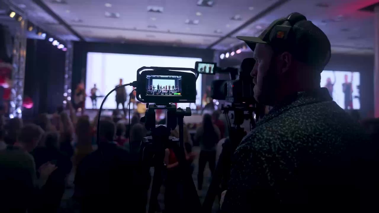 Video cameras filming a corporate band