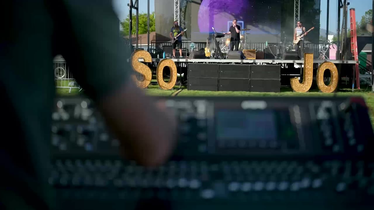 Tom Diamond mixing a live band outdoors