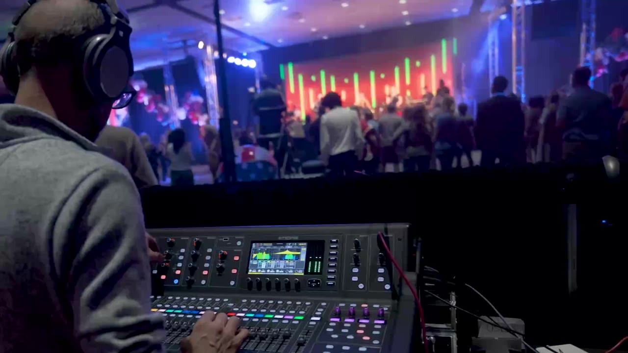 Engineer mixing a corporate band from front of house