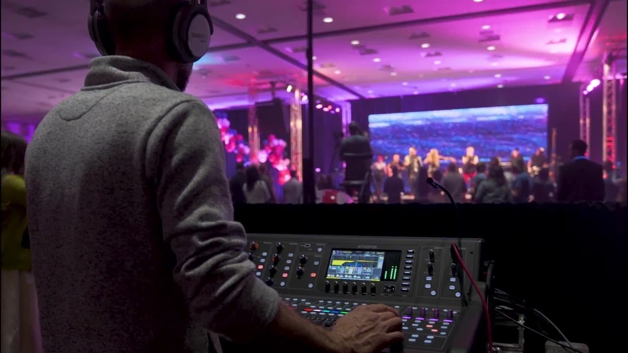 Engineer mixing live sound at a corporate event