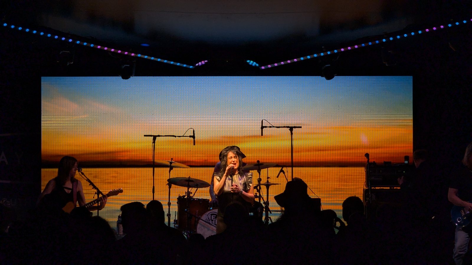 A band performing on the Daybreak summer concert stage