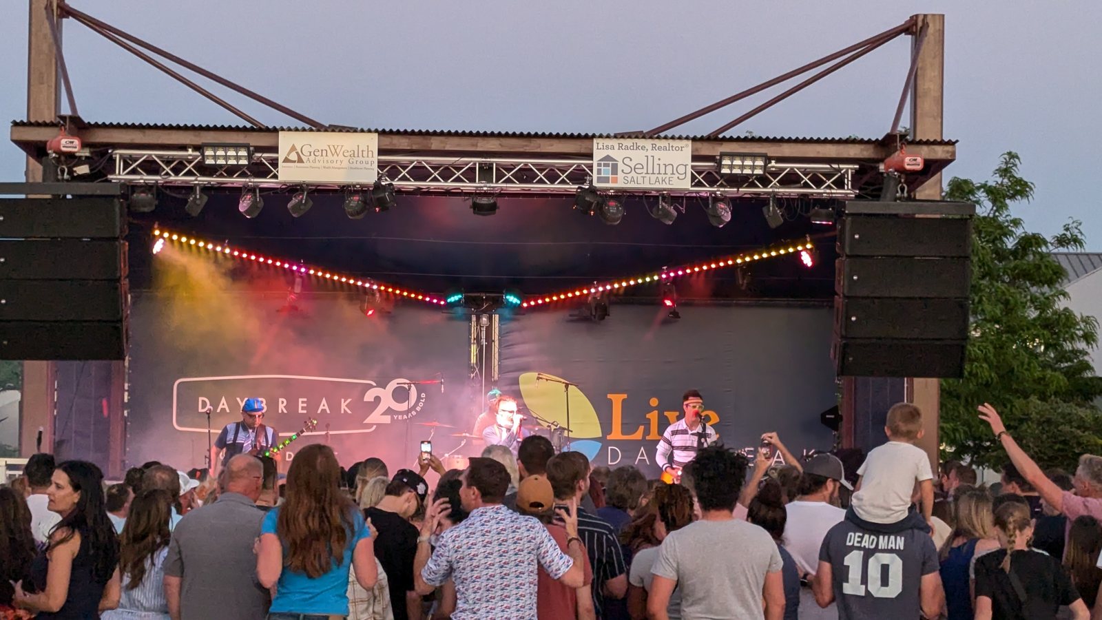 Crowd dancing near the stage at a Daybreak concert