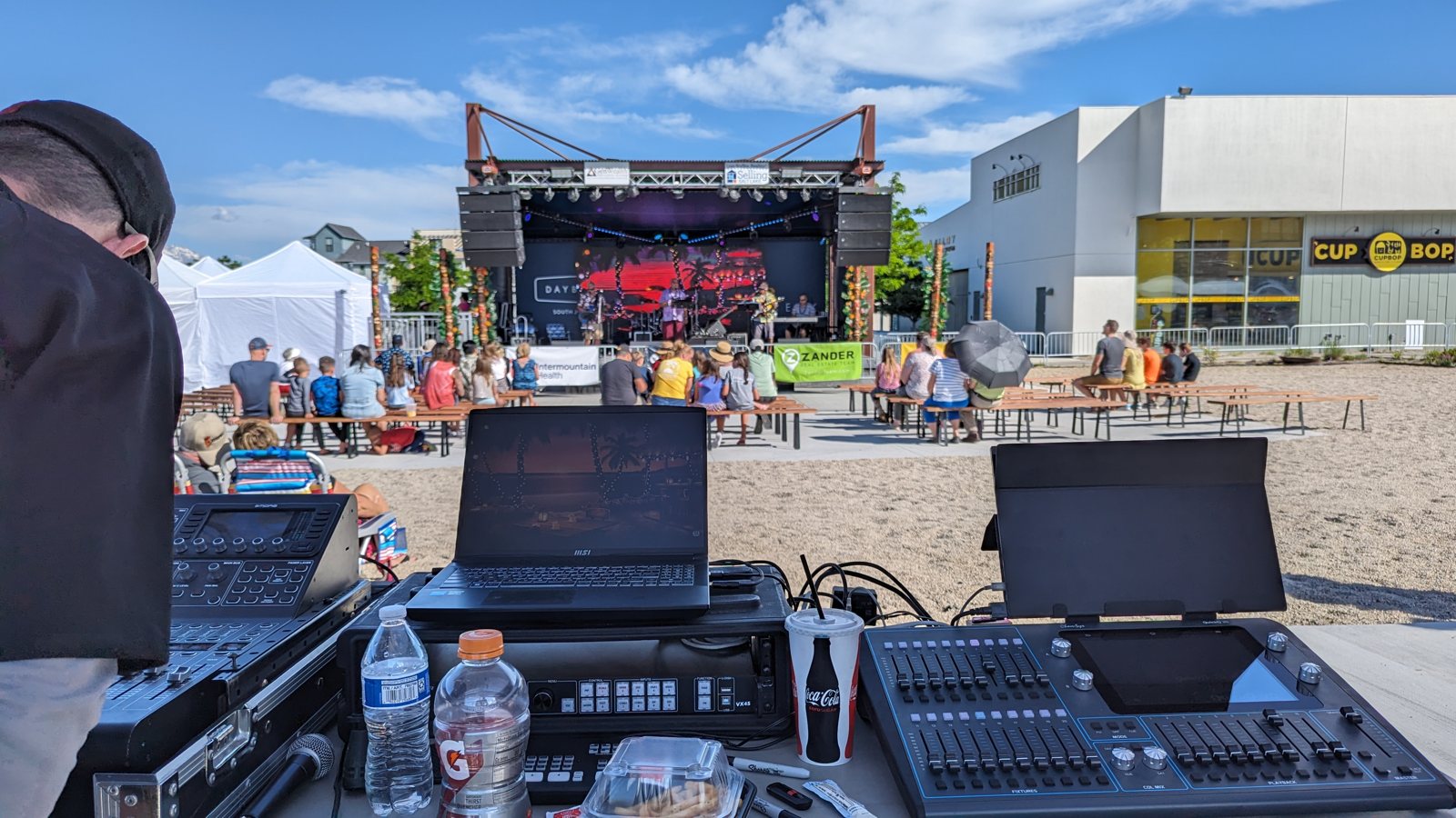 A True AV engineer at the outdoor front-of-house console during a Daybreak concert