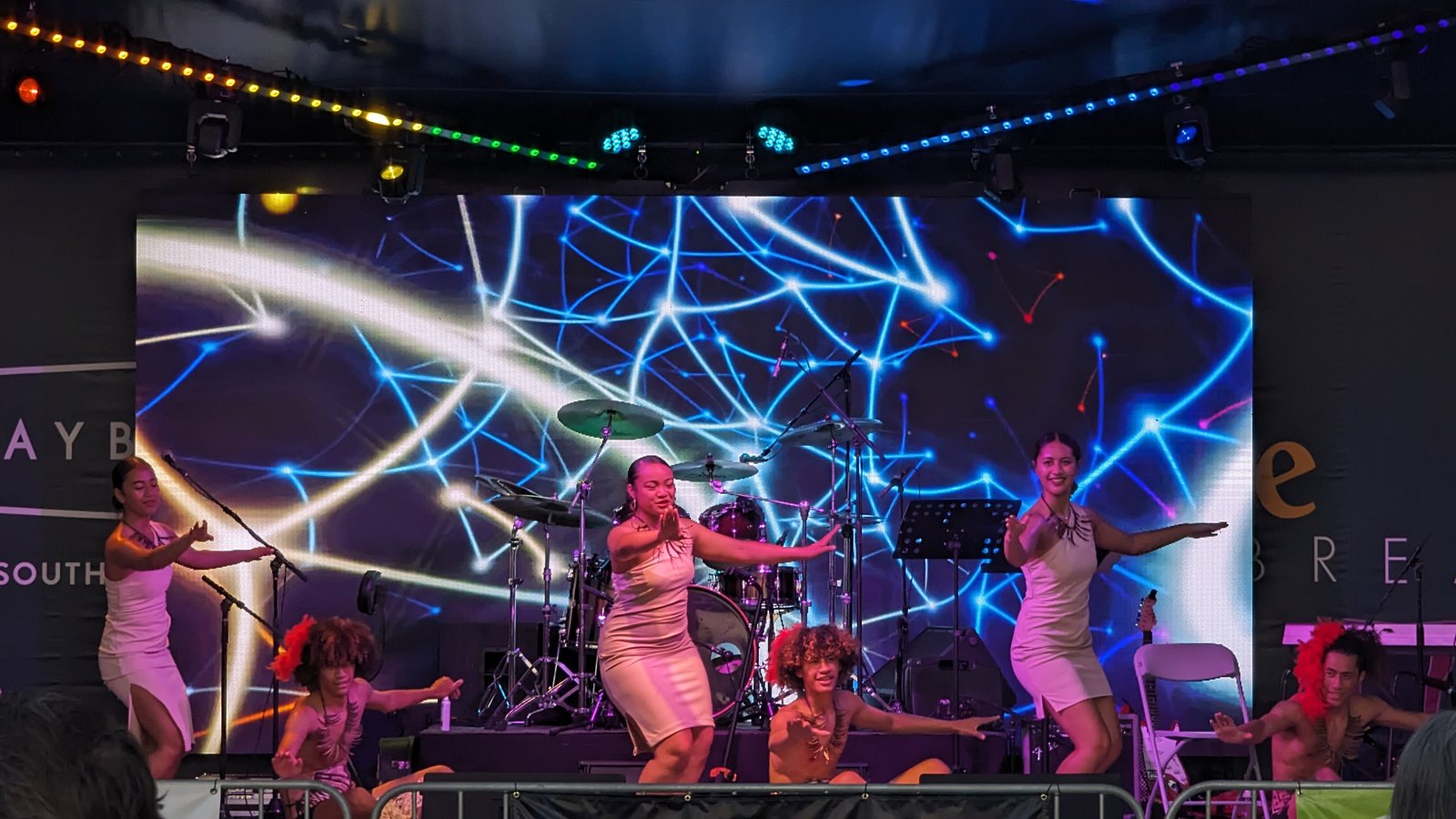 Stage lighting and haze at a Daybreak summer concert at night