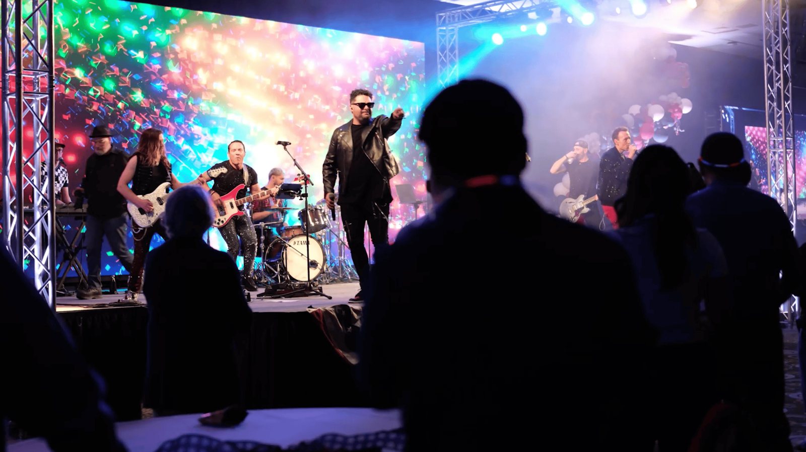 A live band and crowd during the evening of the Kellogg summit