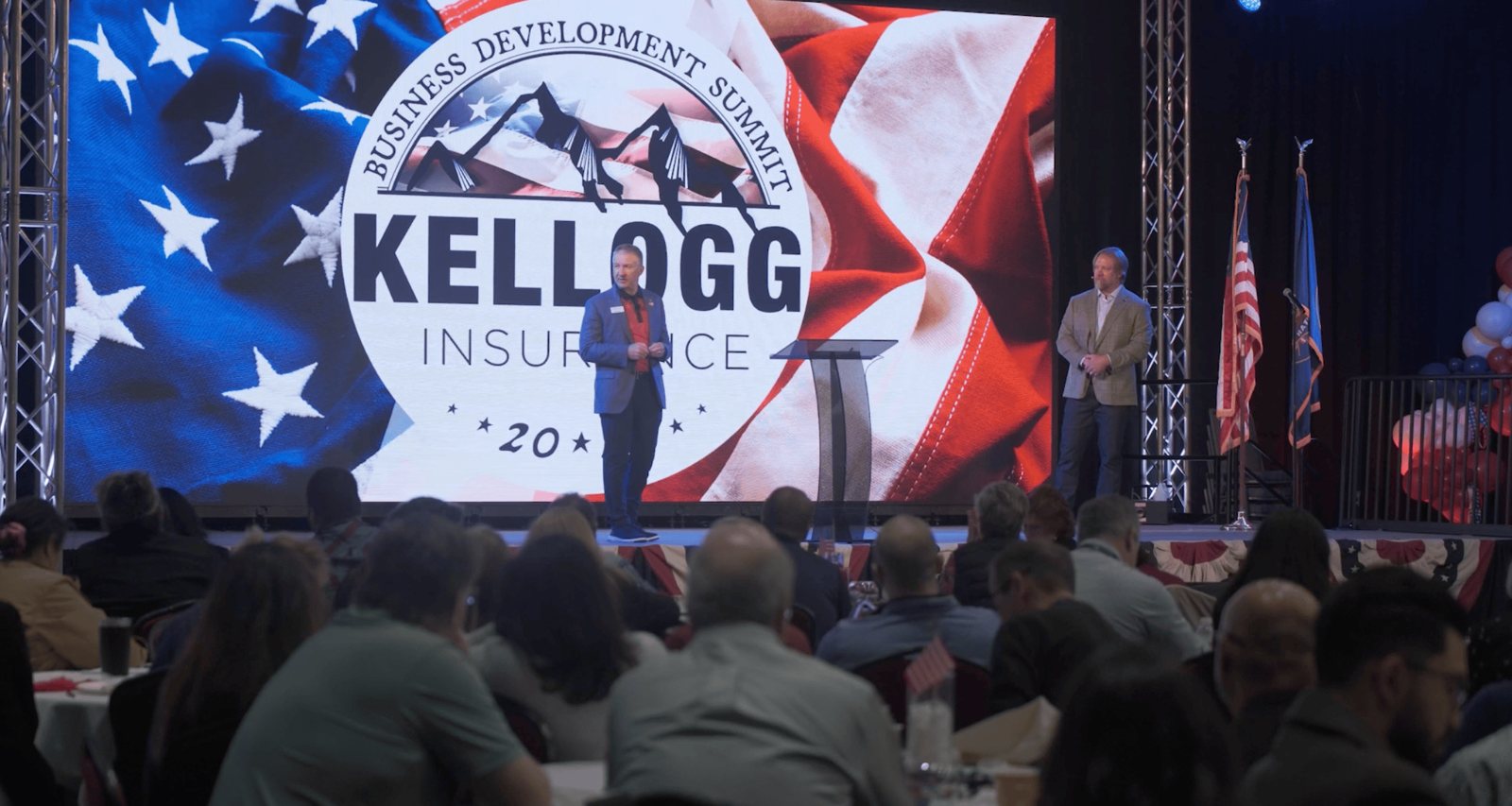 The Kellogg Insurance summit branding on the main LED video wall