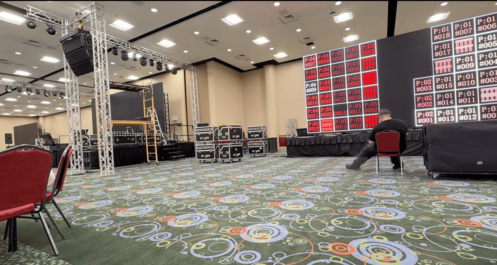 The stage, LED wall, and rig going up during load-in