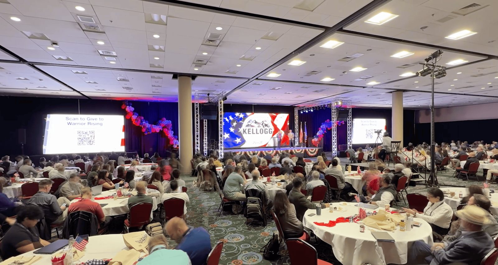 A full general session in the Salt Palace ballroom with the branded LED wall