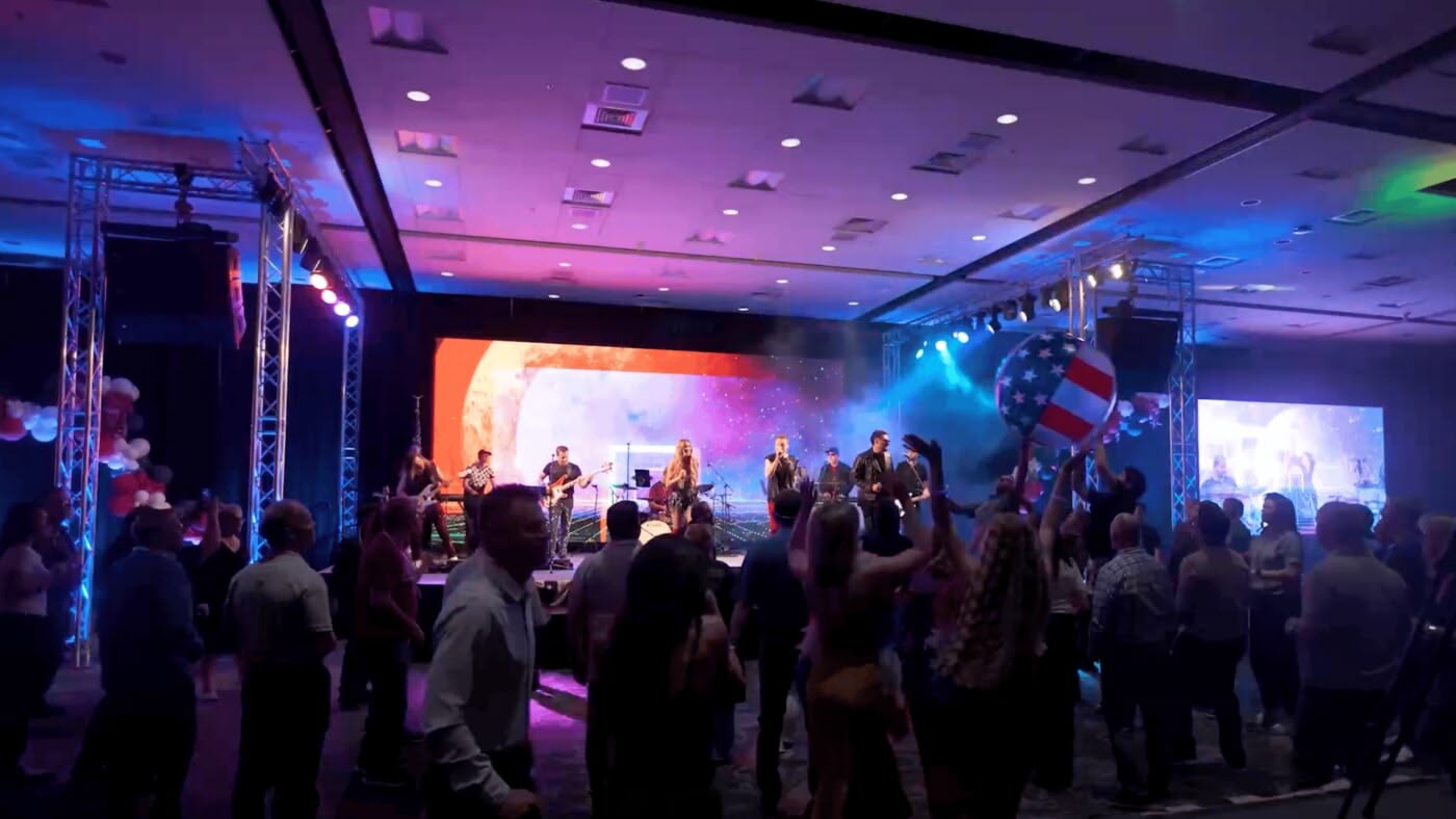 A True AV live band on a full concert stage at a corporate event